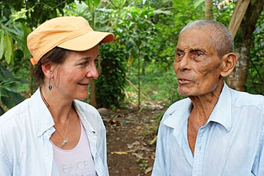 Gail meets with a cacao farmer