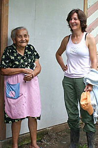 Gail stands with a cacao farmer